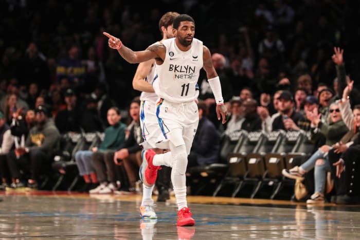 Kyrie Irving runs down the court.